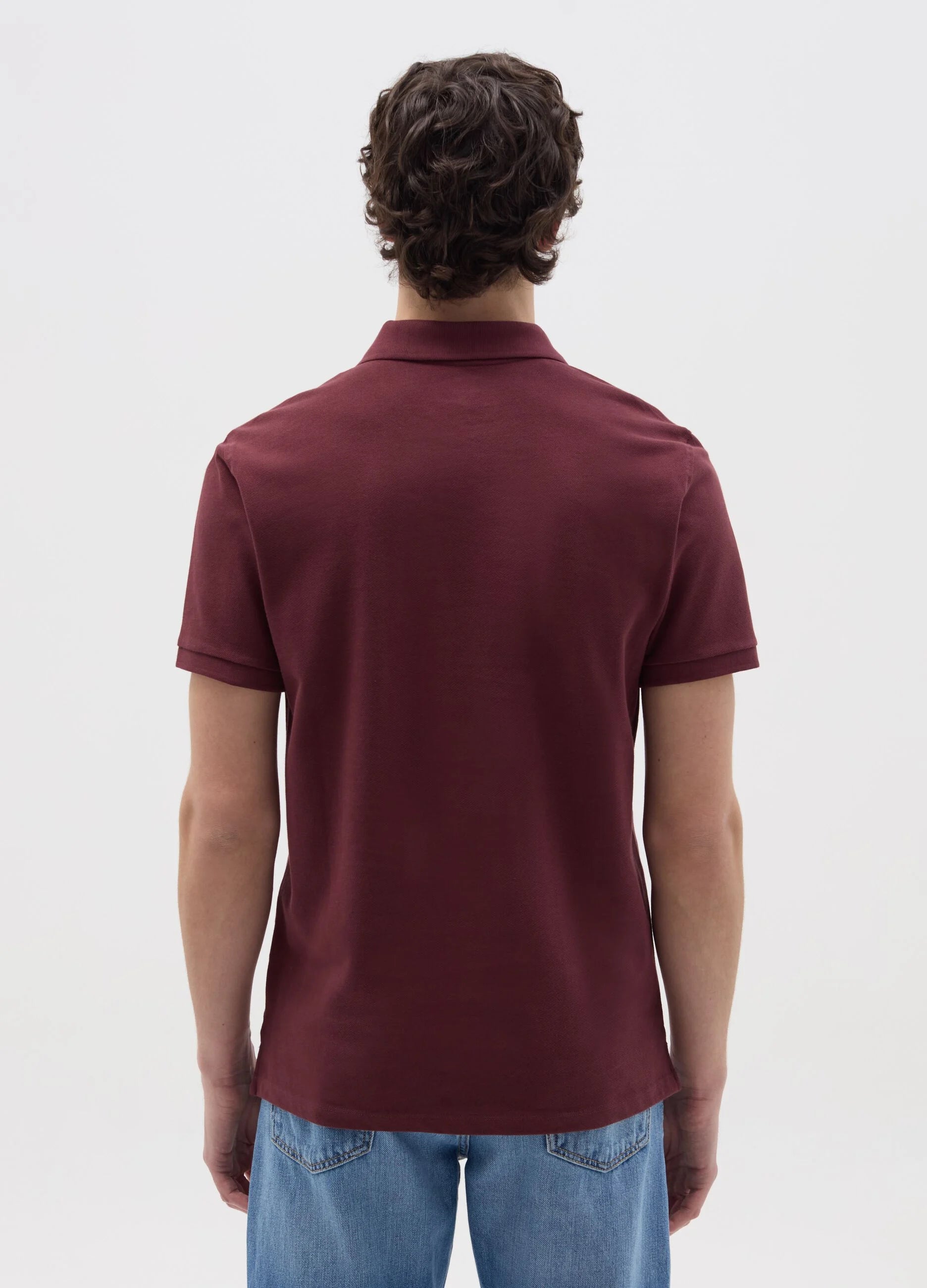 Back view of navy blue cotton polo shirt – stylish casual outfit for men