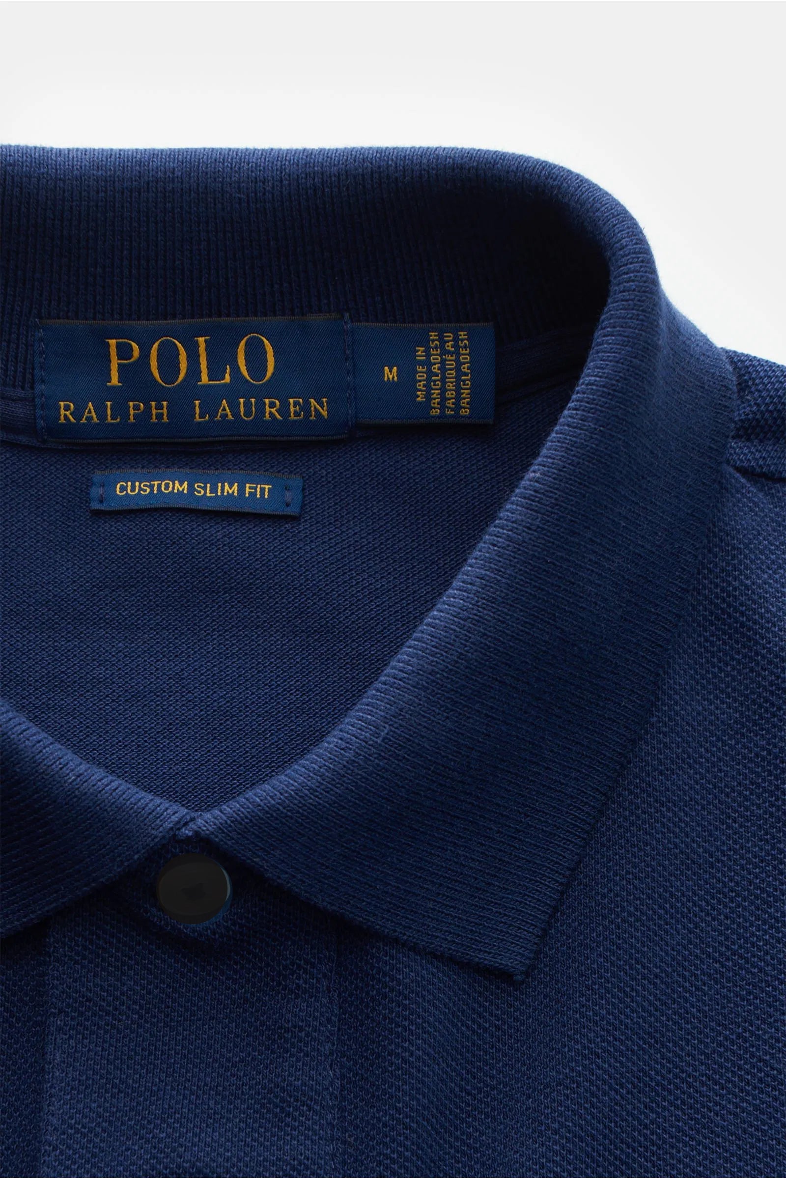 Side view of navy blue cotton polo shirt – stylish casual outfit for men
